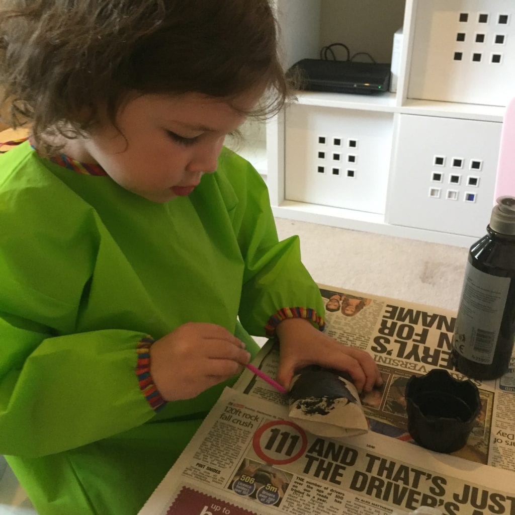 Isla painting her toilet roll