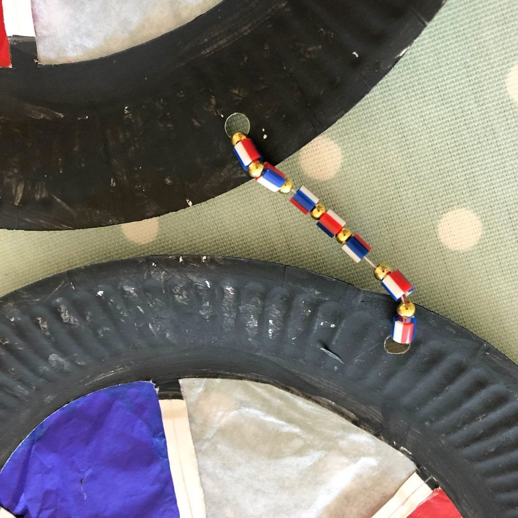 The 3 'wheels' were connected using some thread and tricour beads
