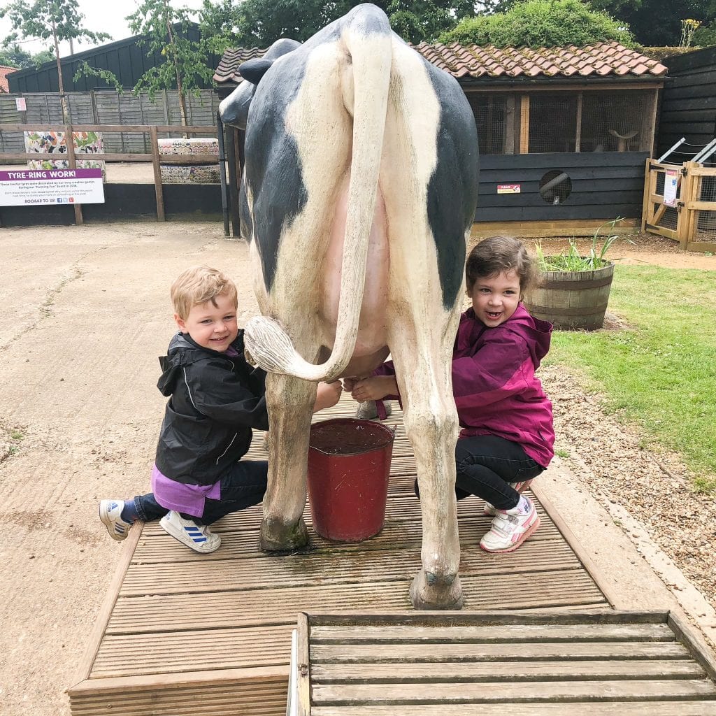 Kids milking the 'faux' cow