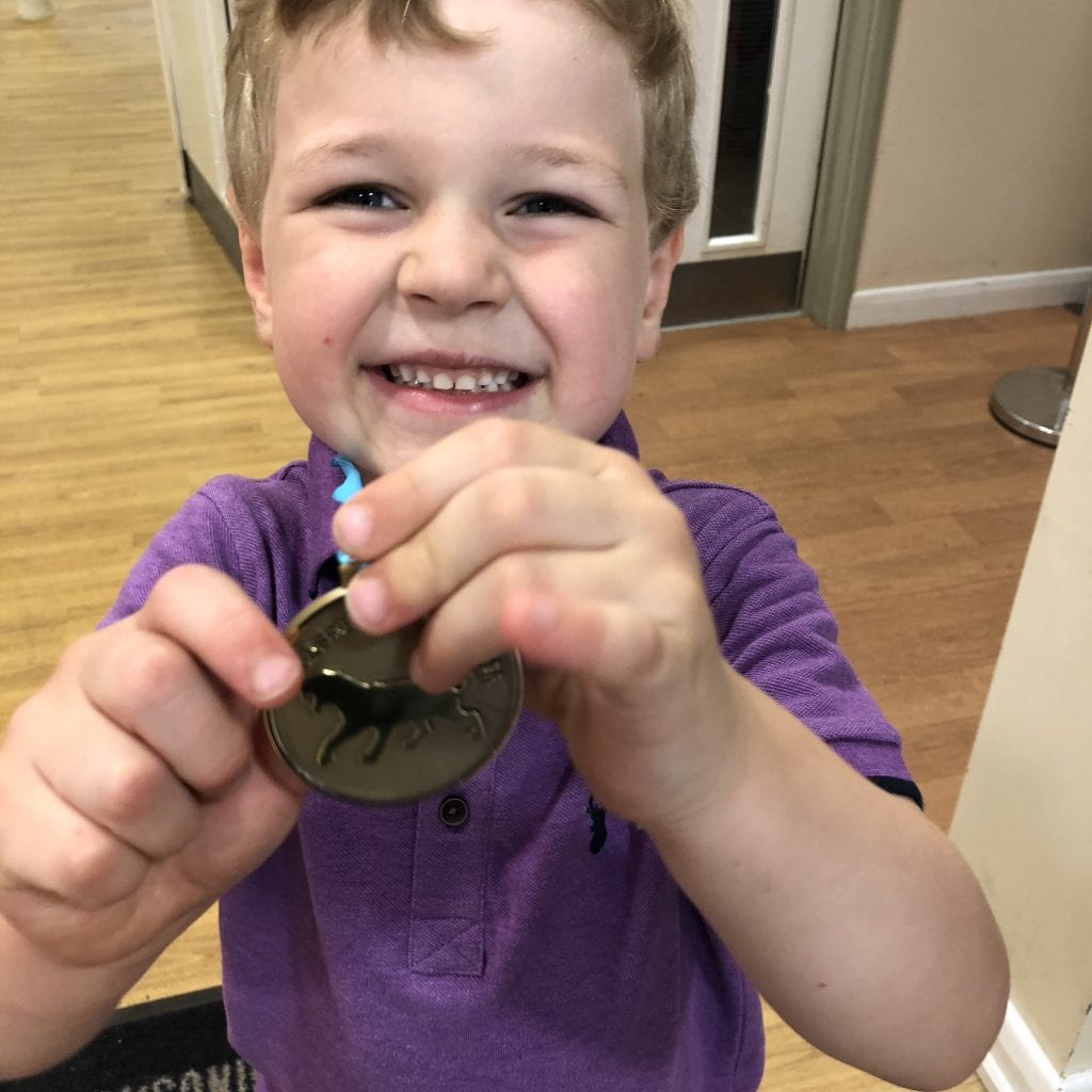 Oliver with his latest medal for his collection