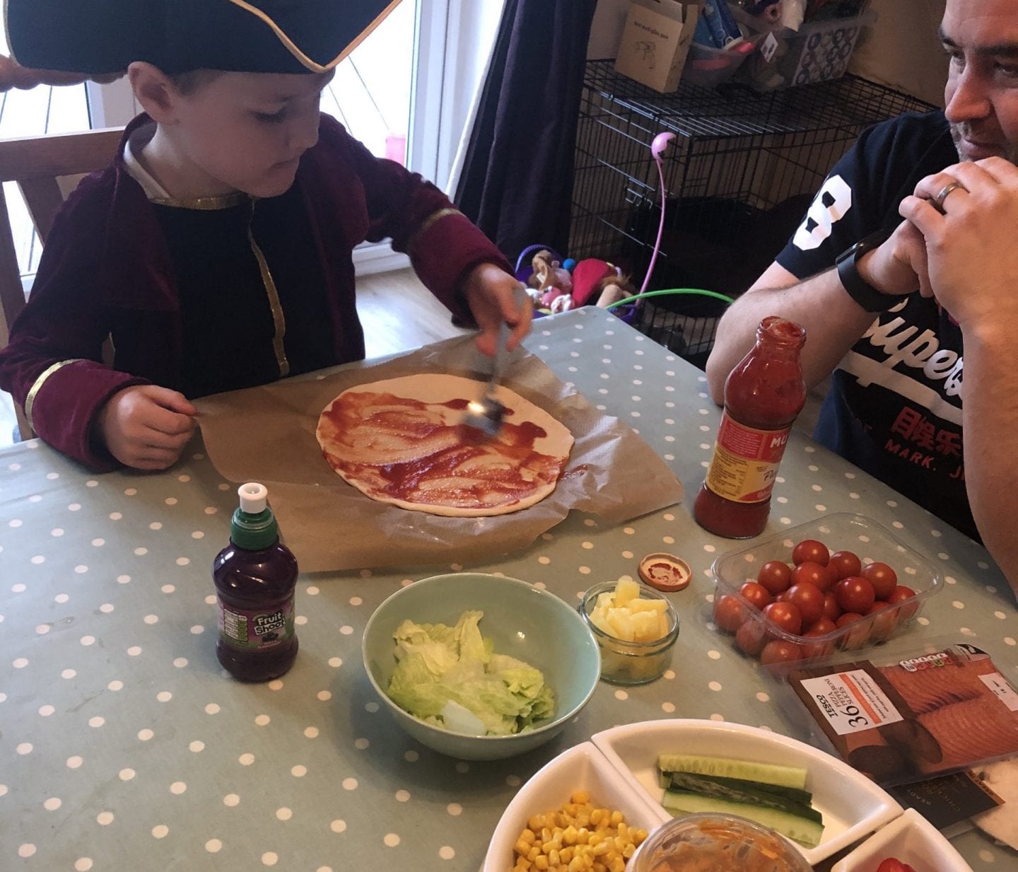Oliver making pizza