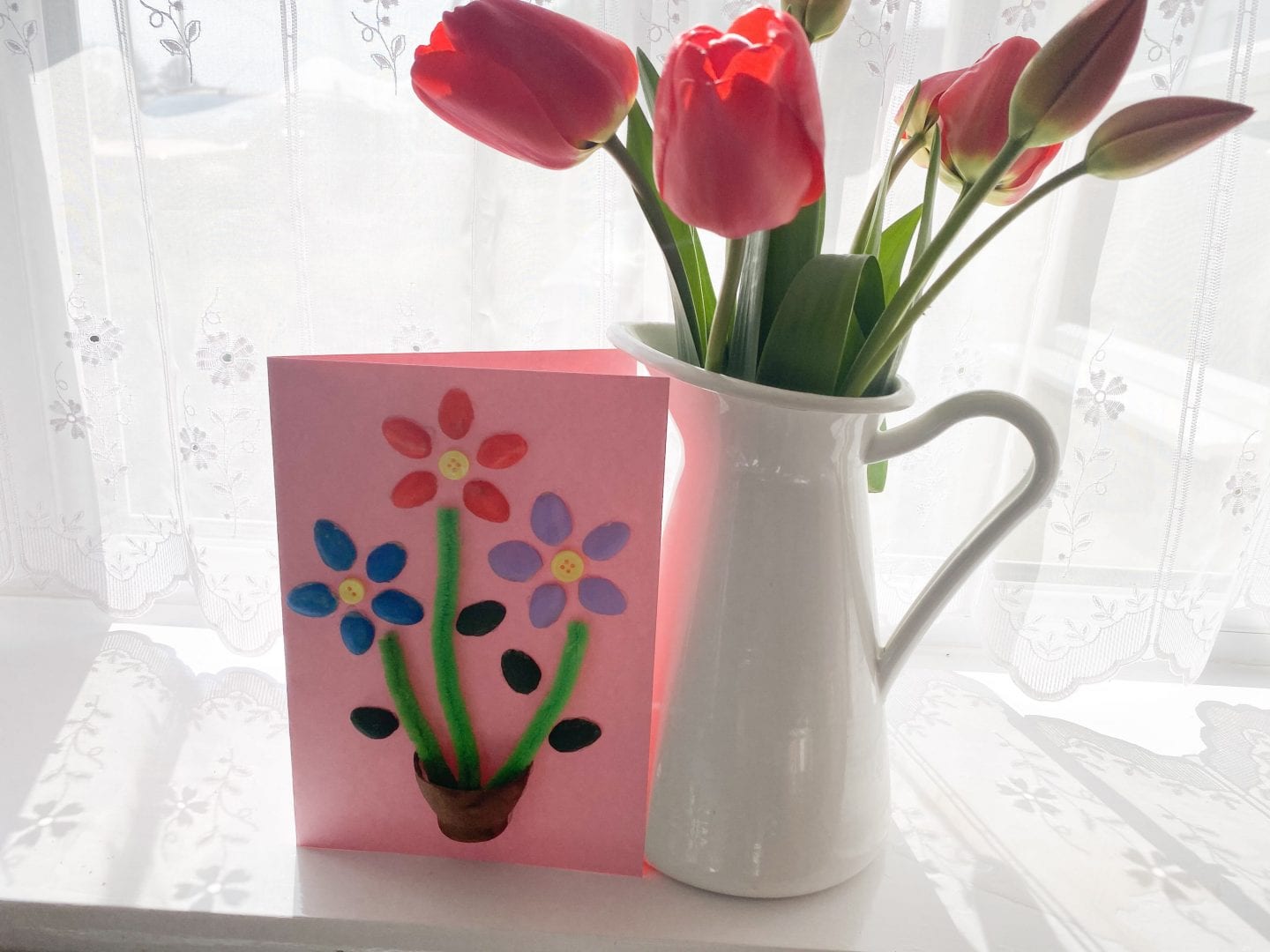 pistachio shell card next to a vase of tulips
