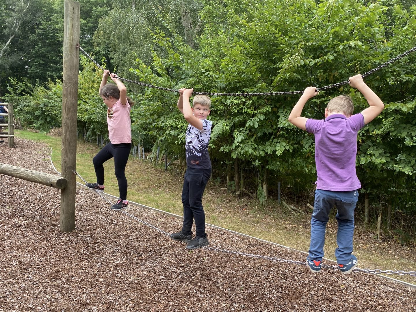 3 children on an assault course