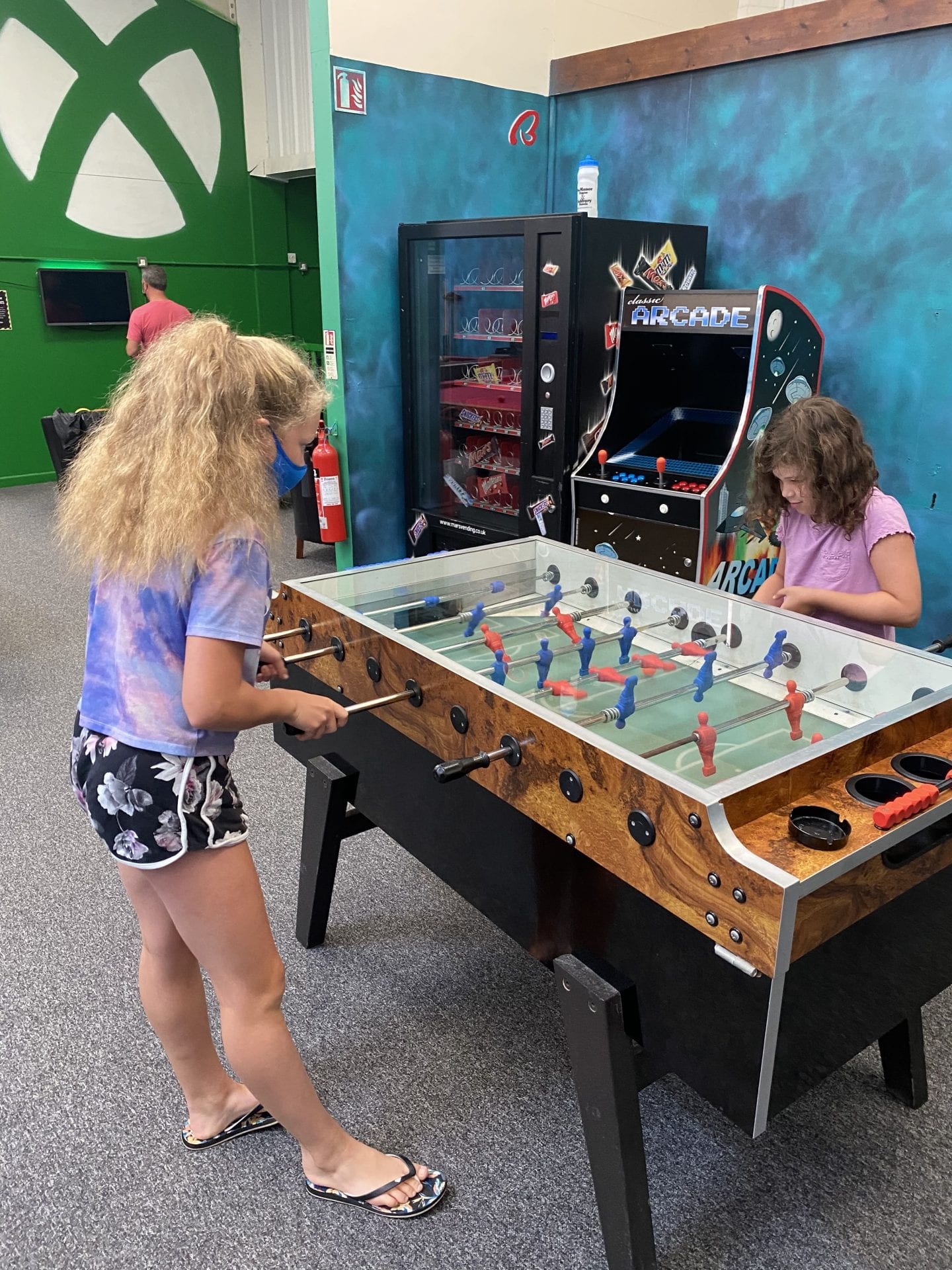 2 girls playing table football