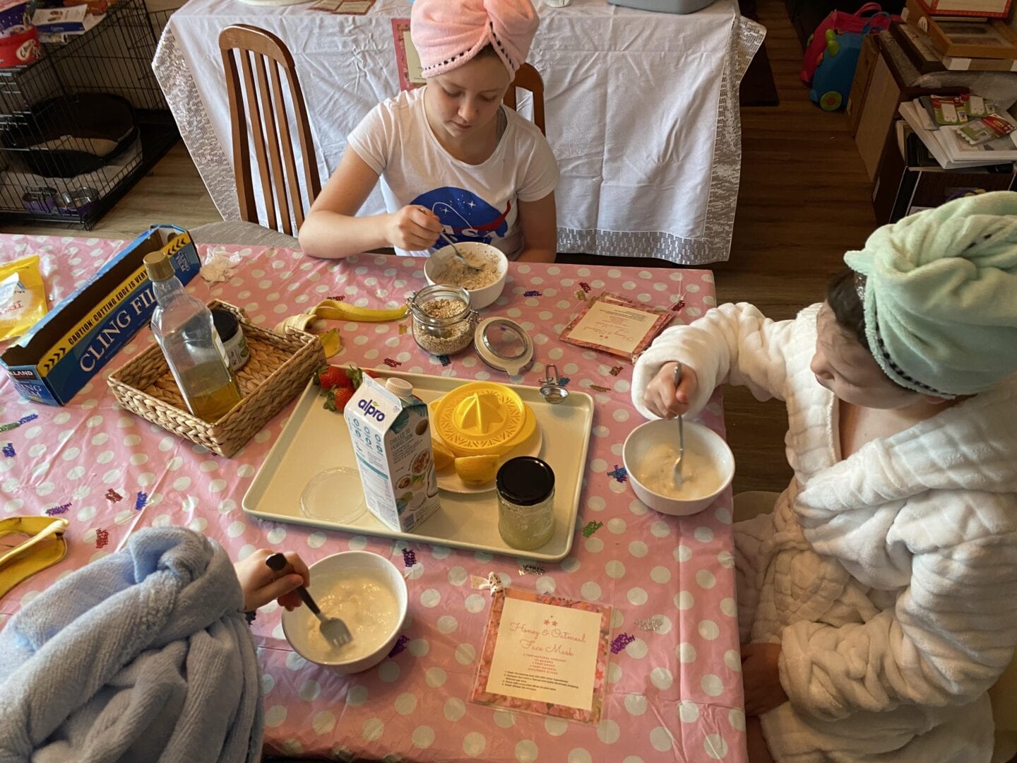 3 children mixing up ingredients to make a homemade face mask
